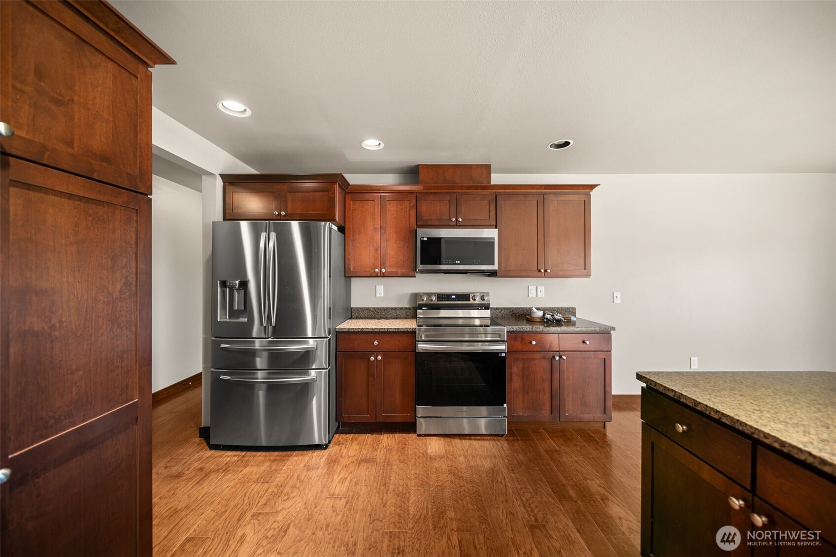 229 Sun Valley Drive Wenatchee, WA 98801 - Photo 12 of 40 a kitchen with stainless steel appliances a refrigerator stove and microwave