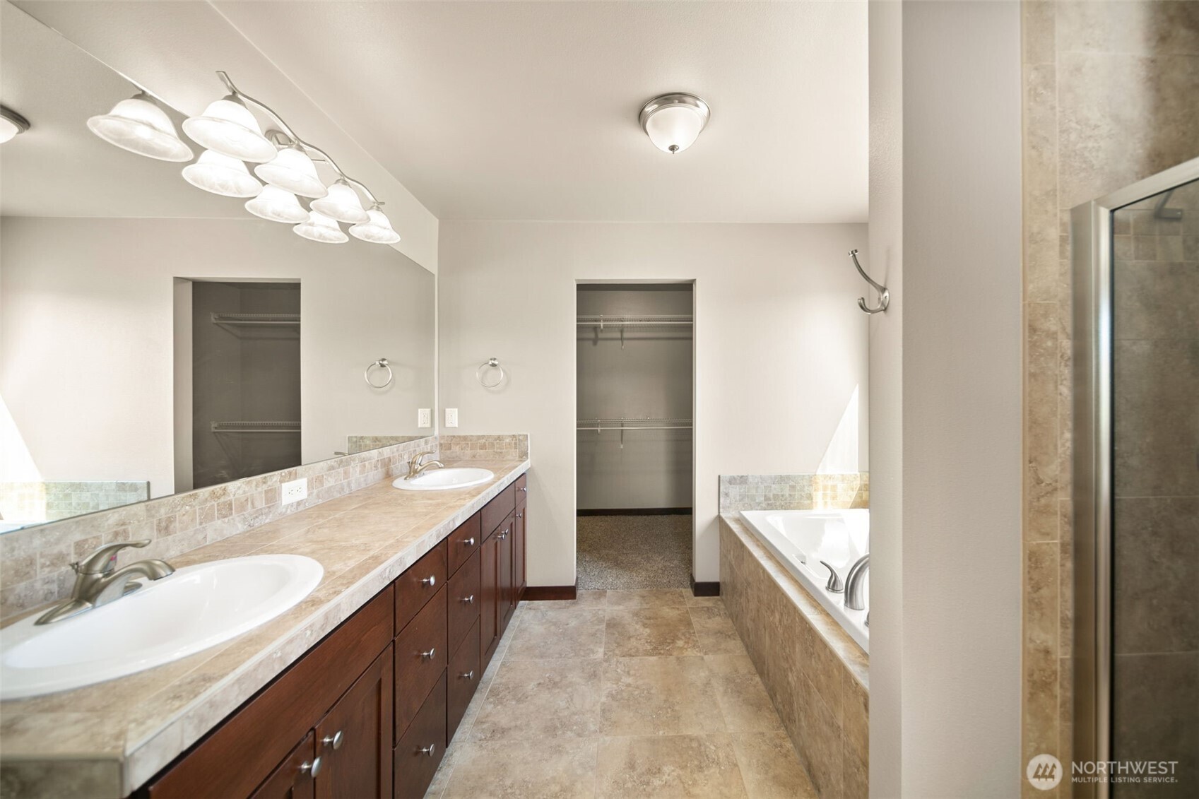 229 Sun Valley Drive Wenatchee, WA 98801 - Photo 19 of 40 a spacious bathroom with a double vanity sink and a mirror