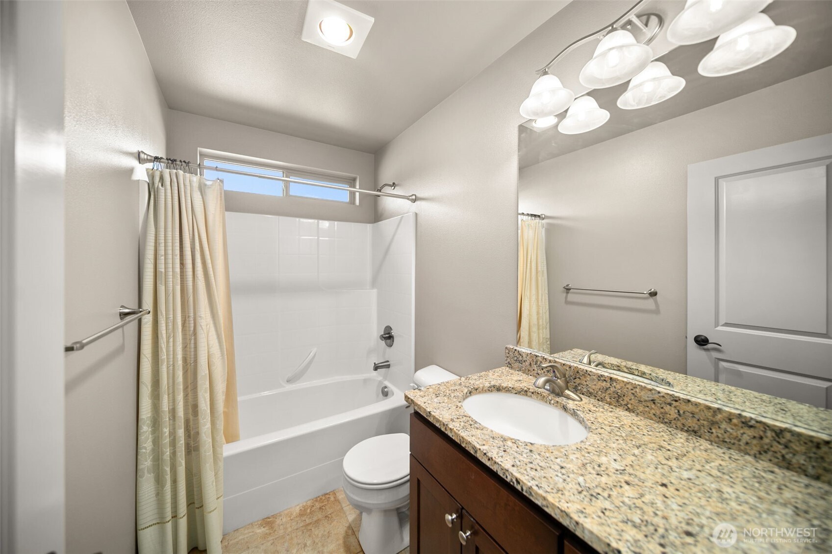 229 Sun Valley Drive Wenatchee, WA 98801 - Photo 26 of 40 a bathroom with a granite countertop double vanity sink mirror toilet shower and bathtub