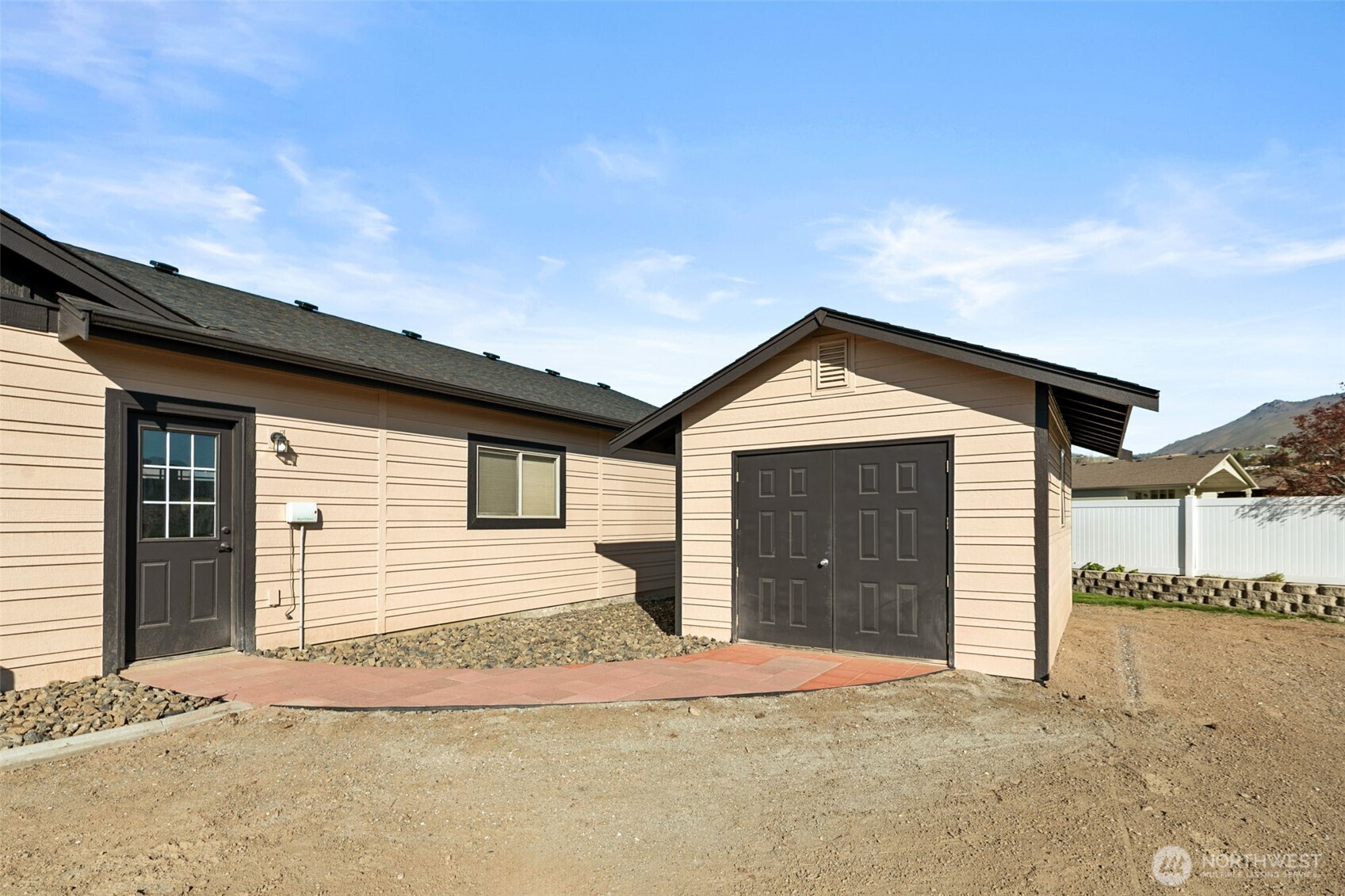 229 Sun Valley Drive Wenatchee, WA 98801 - Photo 34 of 40 a front view of a house with a garage
