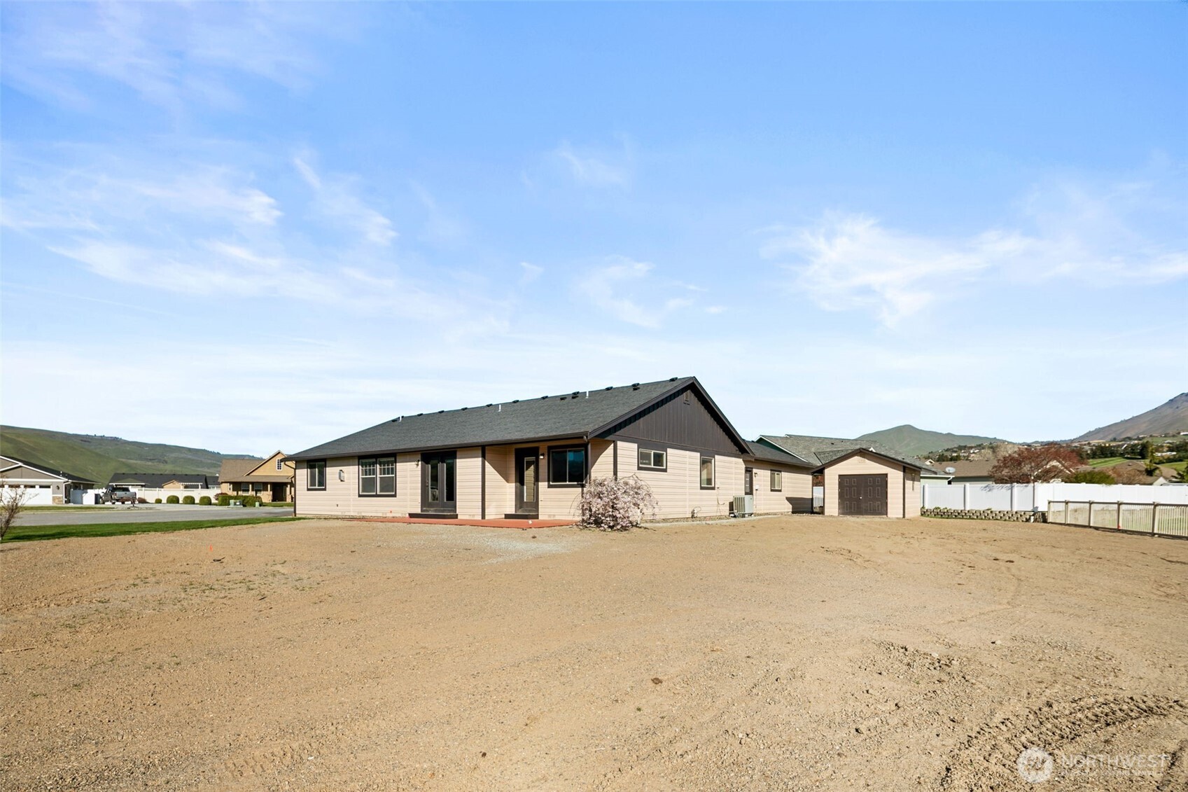 229 Sun Valley Drive Wenatchee, WA 98801 - Photo 35 of 40 a front view of a house with large windows