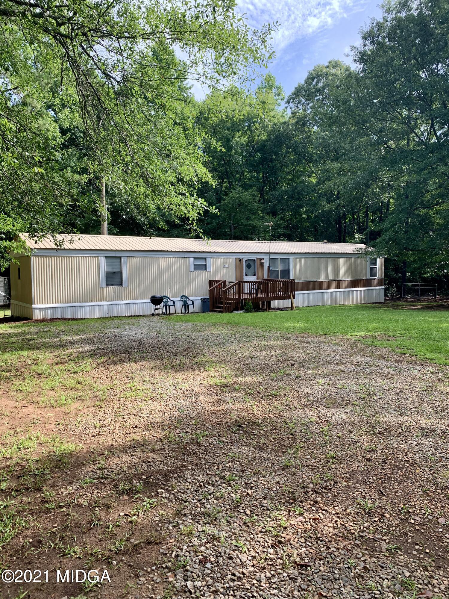 777 Watson Road Forsyth, GA 31029 - Photo 3 of 16 a view of a house with a yard and sitting area