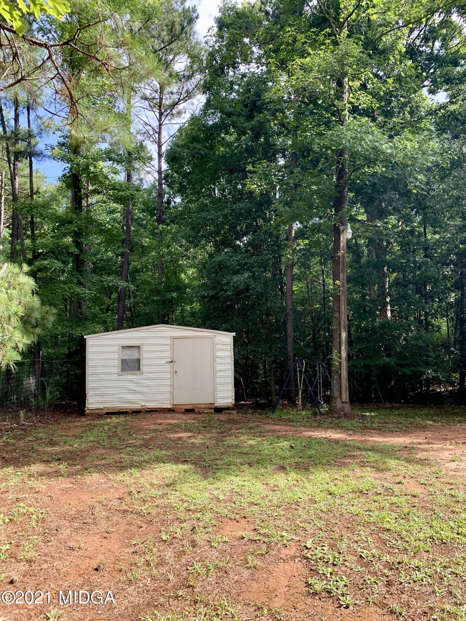 777 Watson Road Forsyth, GA 31029 - Photo 4 of 16 a view of a back yard