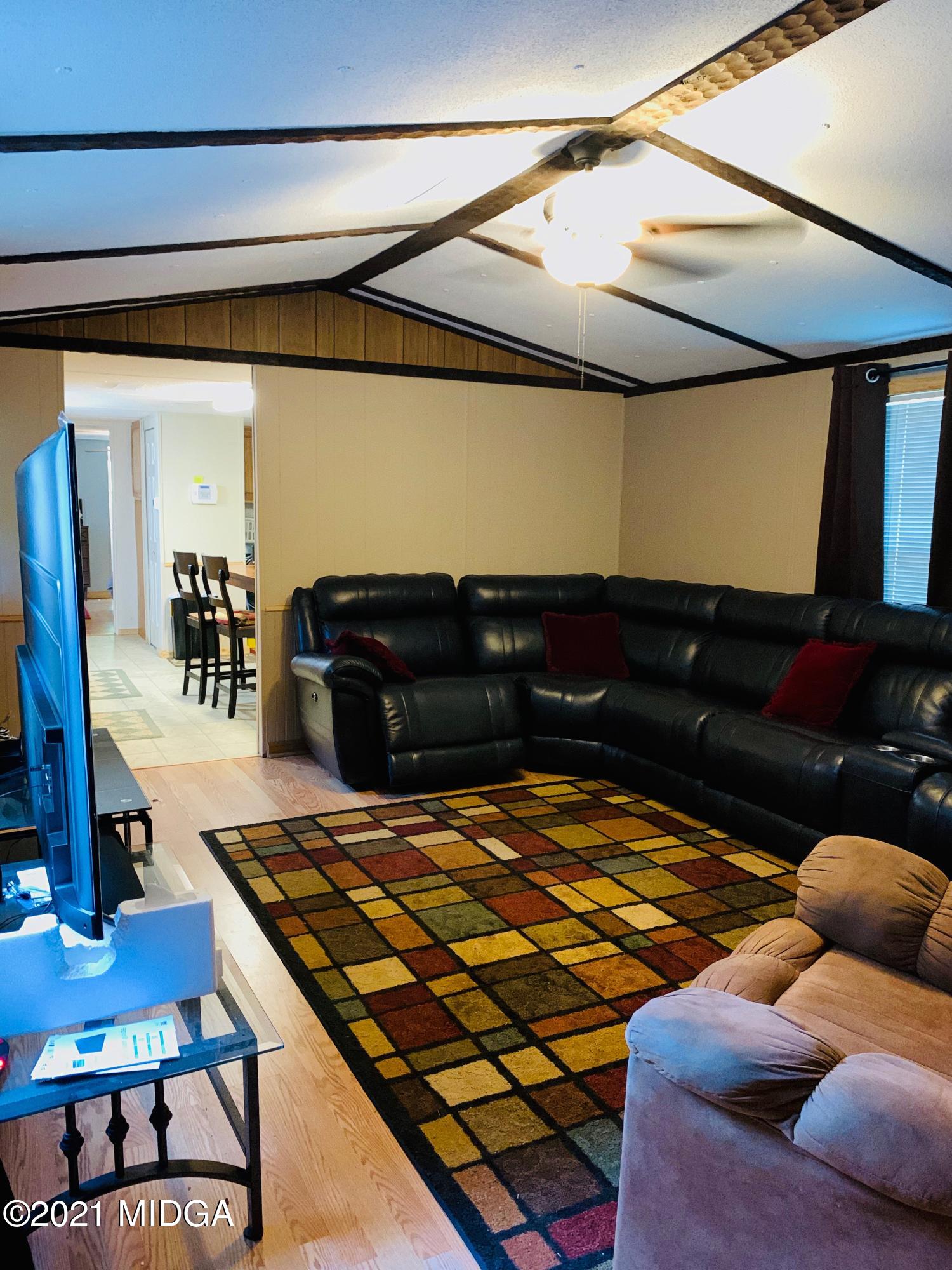 777 Watson Road Forsyth, GA 31029 - Photo 6 of 16 a bedroom with a bed and a dresser