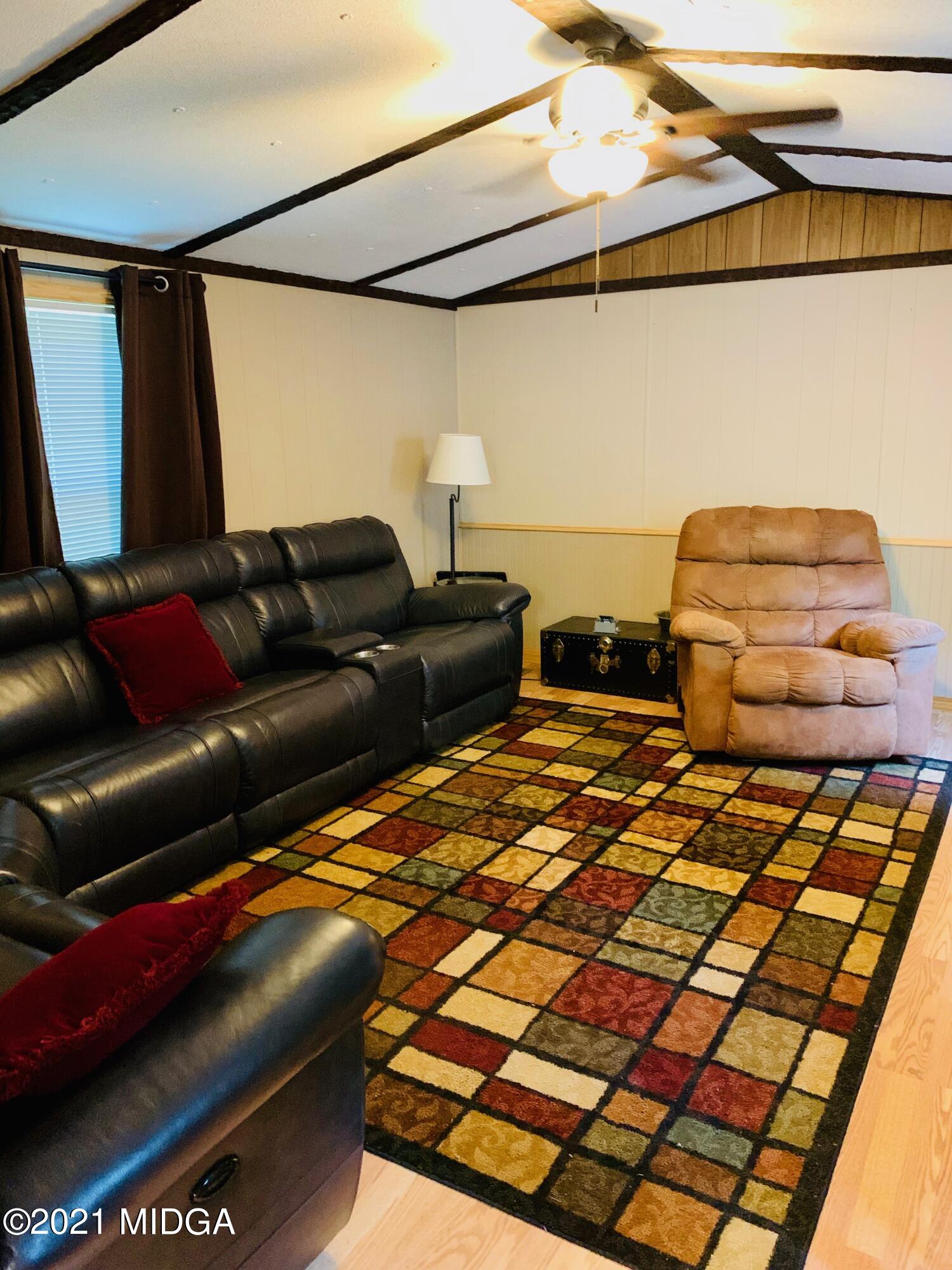 777 Watson Road Forsyth, GA 31029 - Photo 7 of 16 a living room with couch