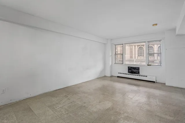 an empty room with windows