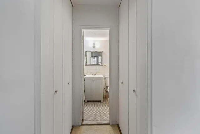 a view of a bedroom from a hallway