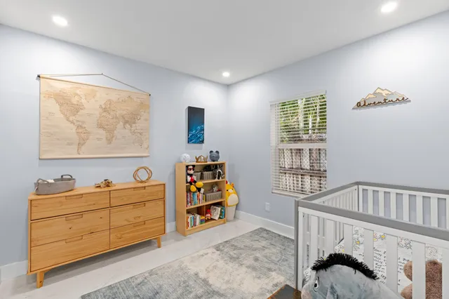 a bedroom with furniture and a window