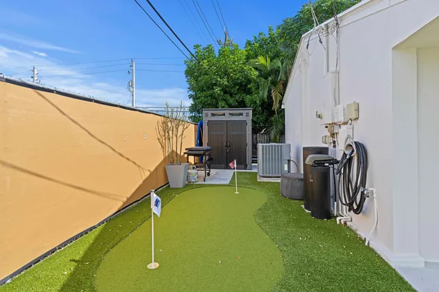 a view of a patio with chairs and a table