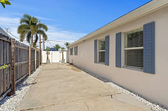 a view of a backyard with sitting area