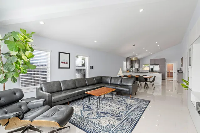 a living room with furniture and a rug