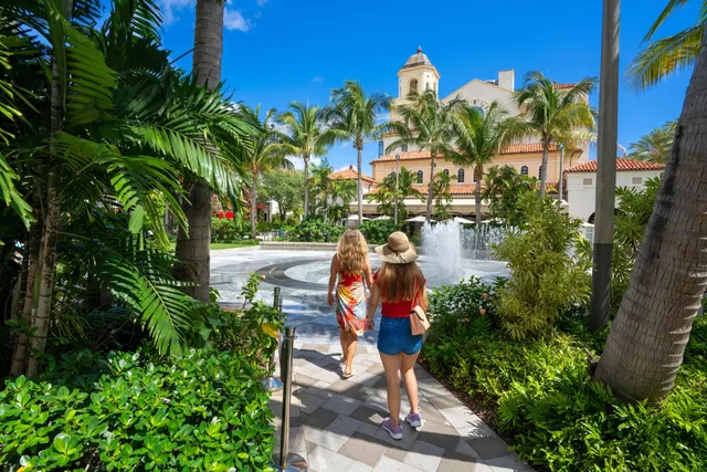 a view of swimming pool with outdoor seating and city view