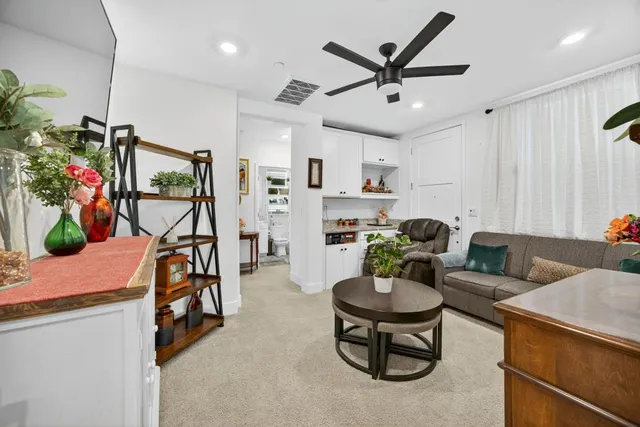 a bathroom with a sink toilet vanity and shower