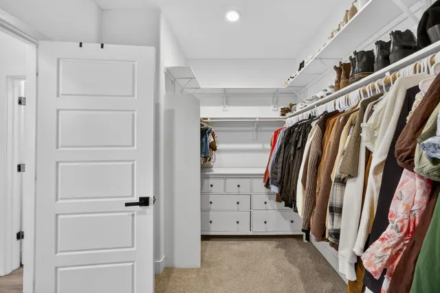 a view of a patio with table and chairs