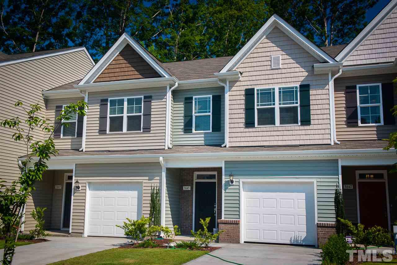 a front view of a house with yard