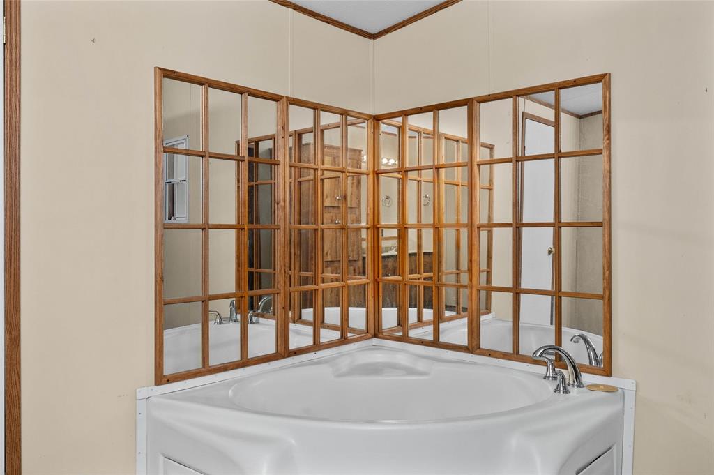 334 Destiny Lane Keatchie, LA 71046 - Photo 15 of 29 Bathroom featuring a garden tub and crown molding