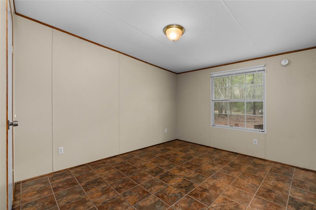 334 Destiny Lane Keatchie, LA 71046 - Photo 23 of 29 Spare room with stone finish flooring