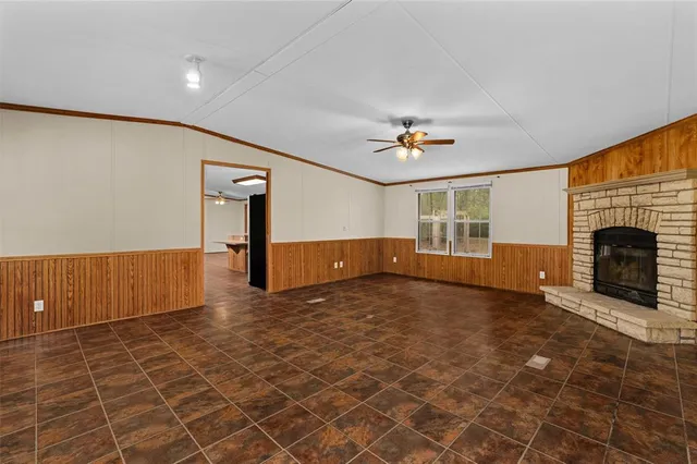 a view of an empty room with a fireplace