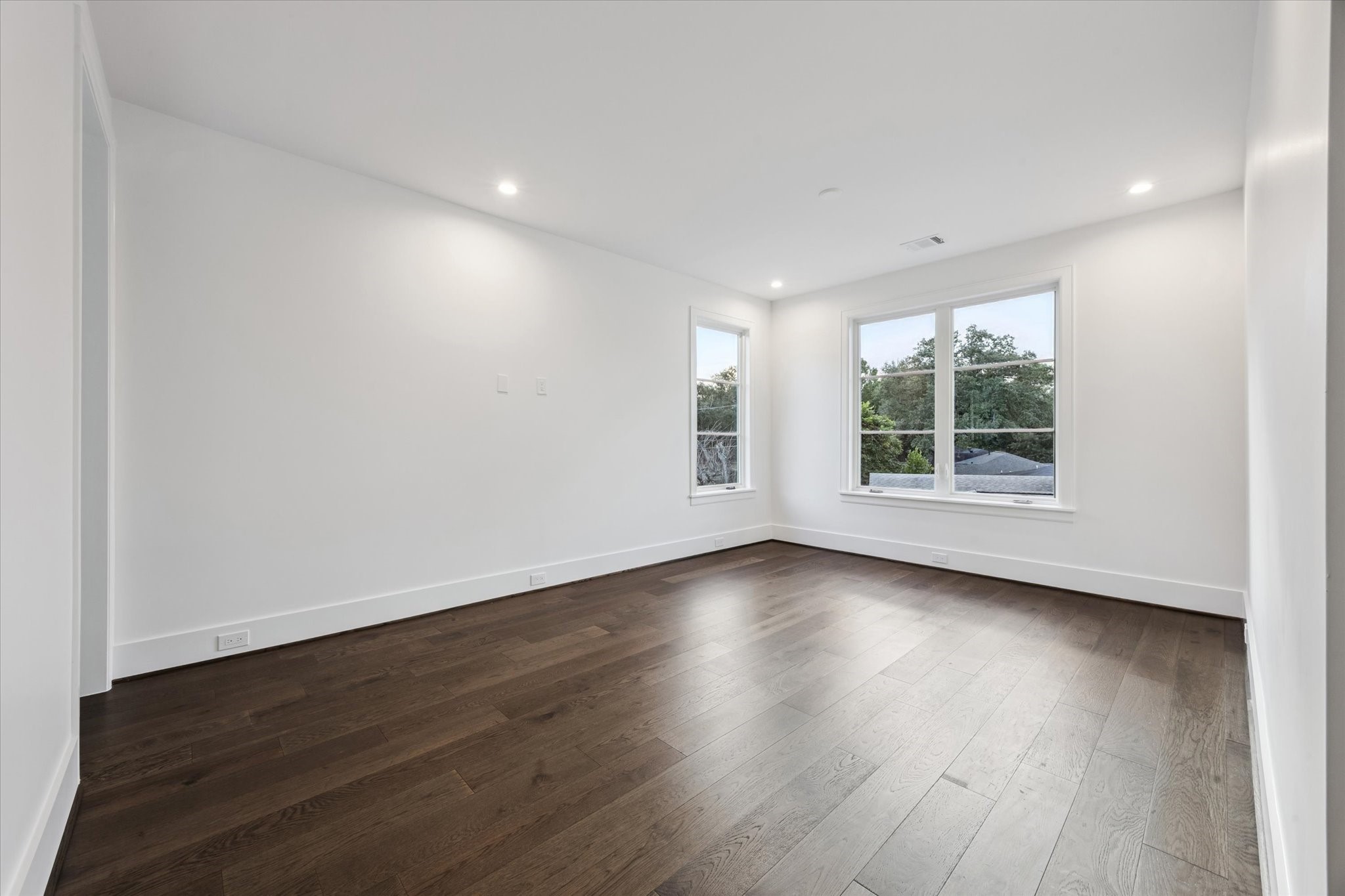 3011 Deal Street Houston, TX 77025 - Photo 30 of 45 an empty room with wooden floor and windows