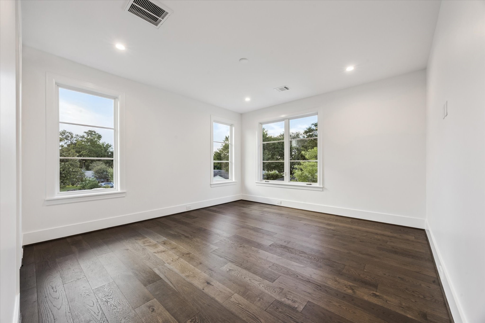 3011 Deal Street Houston, TX 77025 - Photo 31 of 45 an empty room with wooden floor and windows