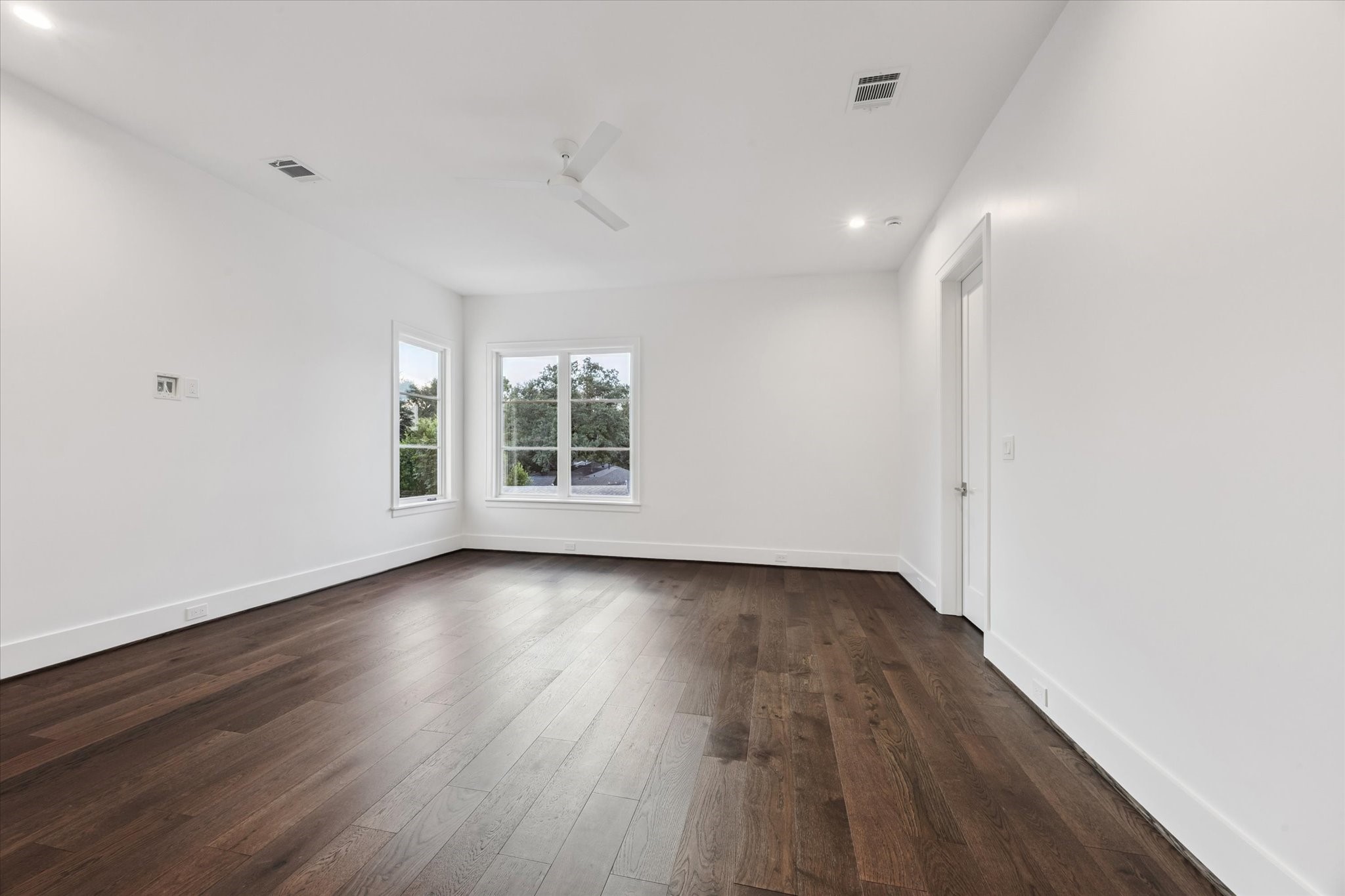 3011 Deal Street Houston, TX 77025 - Photo 32 of 45 an empty room with wooden floor and windows