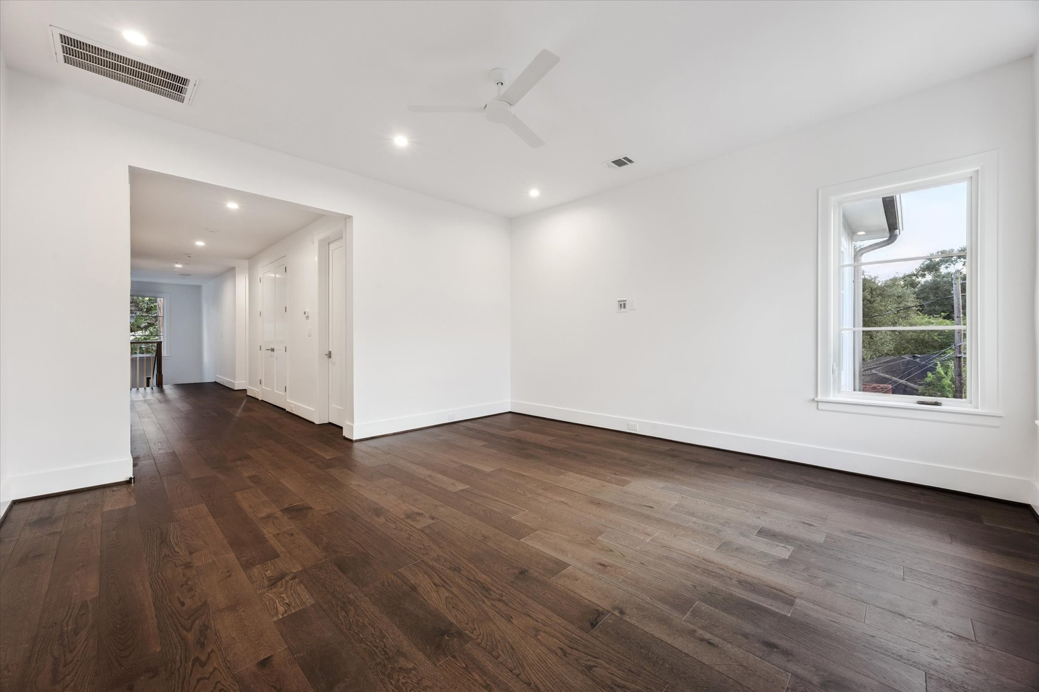 3011 Deal Street Houston, TX 77025 - Photo 33 of 45 an empty room with wooden floor and windows