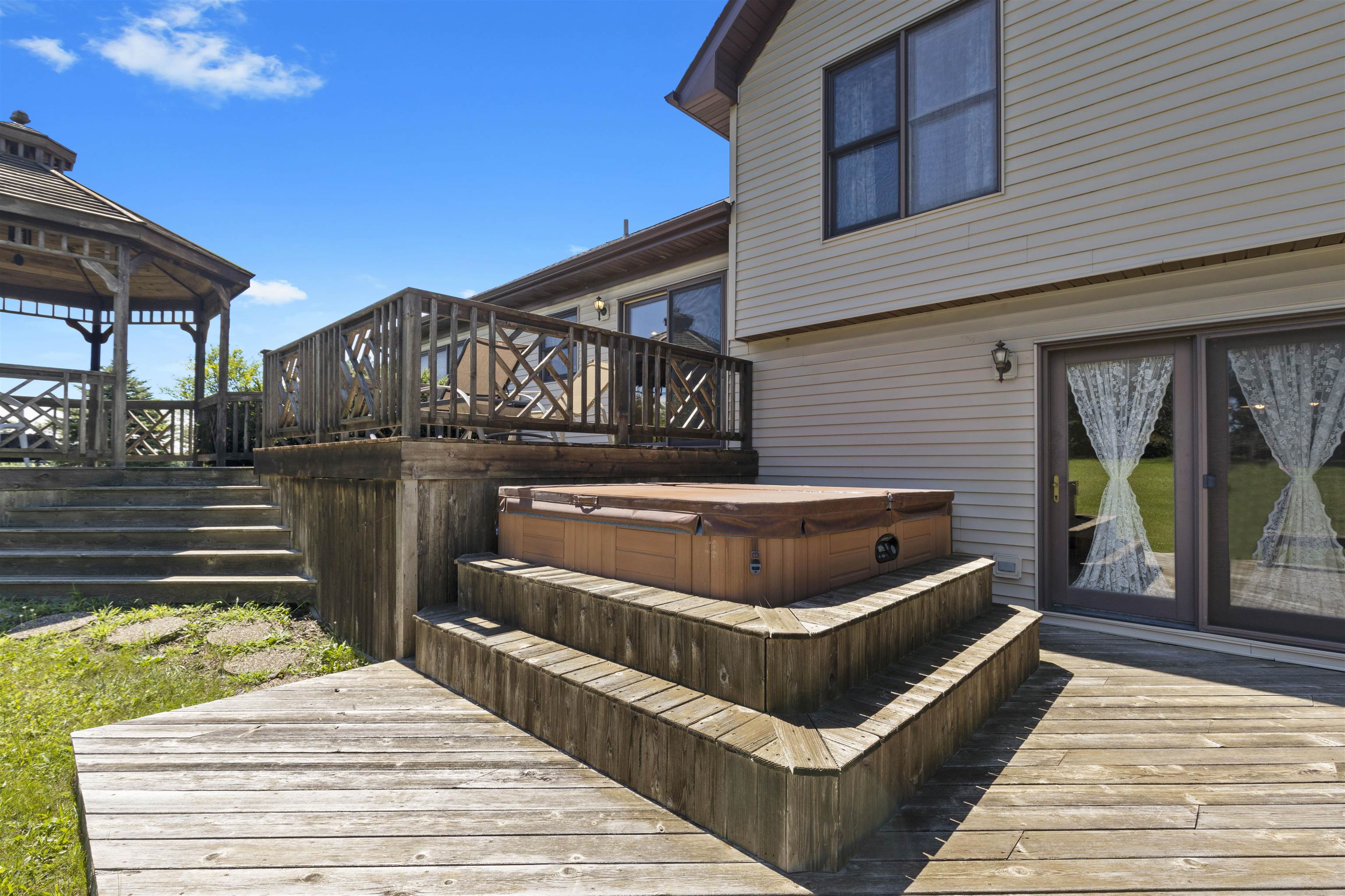708 Busse Road Marengo, IL 60152 - Photo 40 of 60 a view of a balcony with two couches and potted plants with sky view