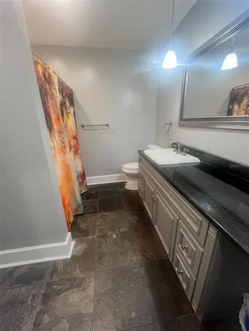 a bathroom with a sink and a toilet