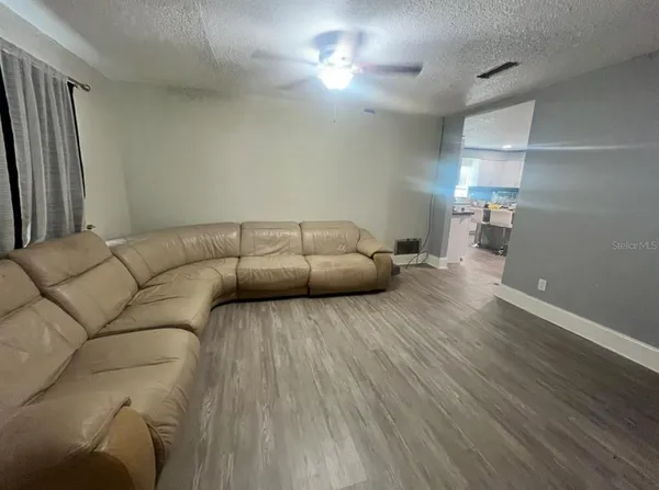 a living room with furniture and a couch