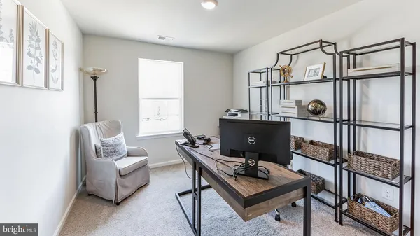 a workspace with furniture and window