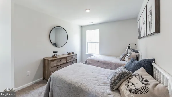 a bedroom with bed and a window