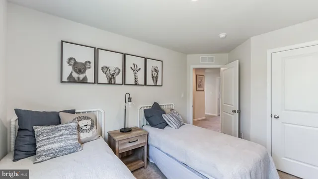 a bedroom with furniture and baby crib