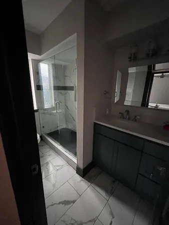 a bathroom with a sink and mirror