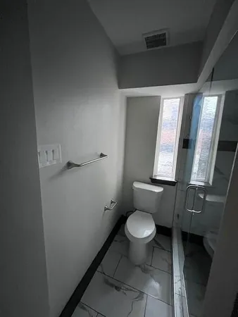 a bathroom with a toilet
