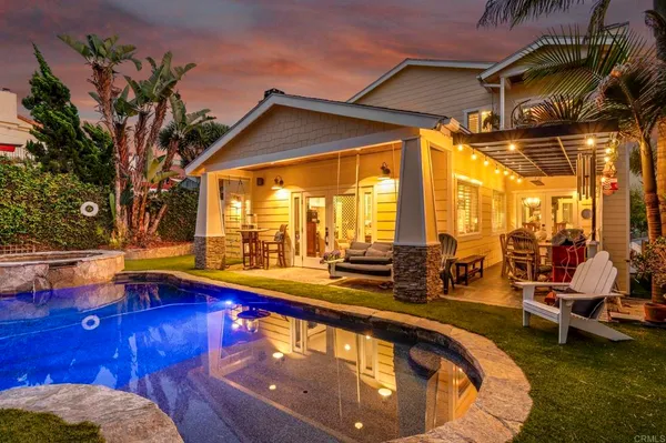 a view of swimming pool with outdoor seating