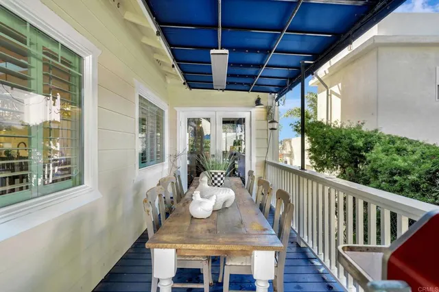 a view of a house with swimming pool and sitting area
