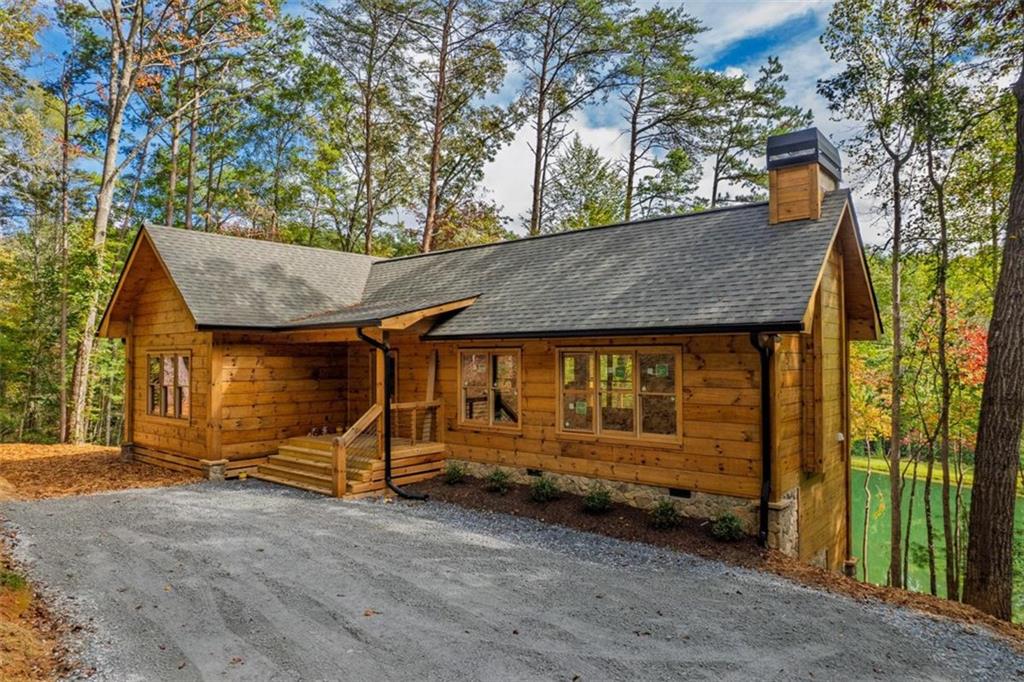 85 Moreland Trail Blue Ridge, GA 30513 - Photo 14 of 37 a backyard of a house with barbeque oven and door