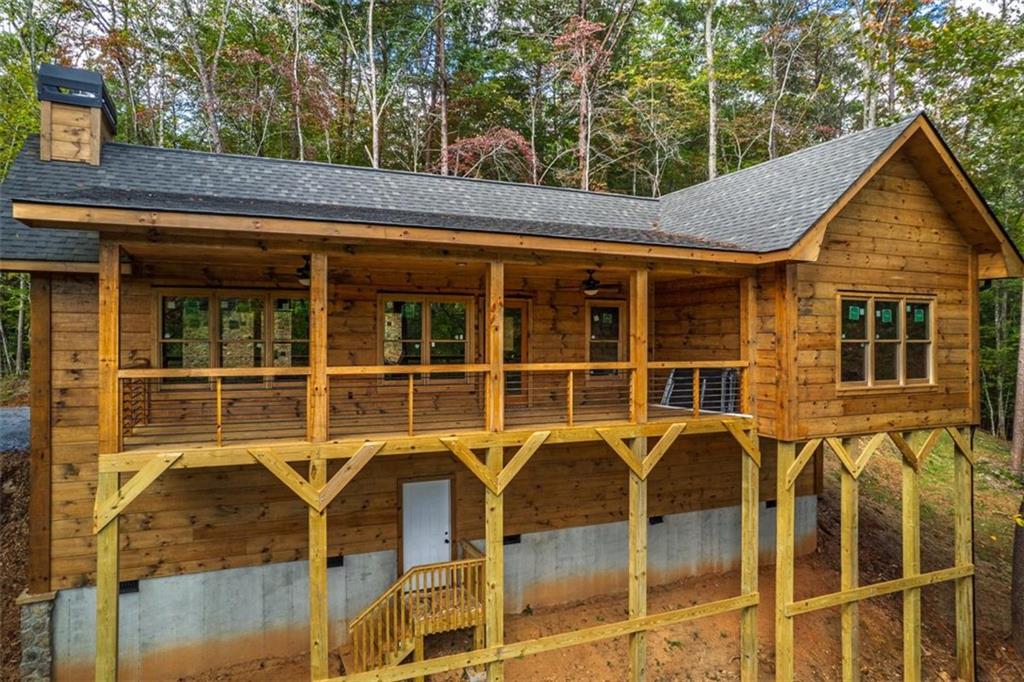 85 Moreland Trail Blue Ridge, GA 30513 - Photo 2 of 37 a view of a house with a window and wooden fence