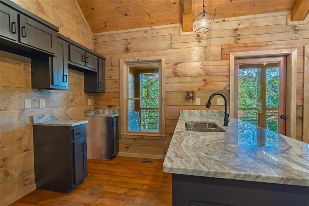 85 Moreland Trail Blue Ridge, GA 30513 - Photo 34 of 37 a kitchen with sink a stove and cabinets