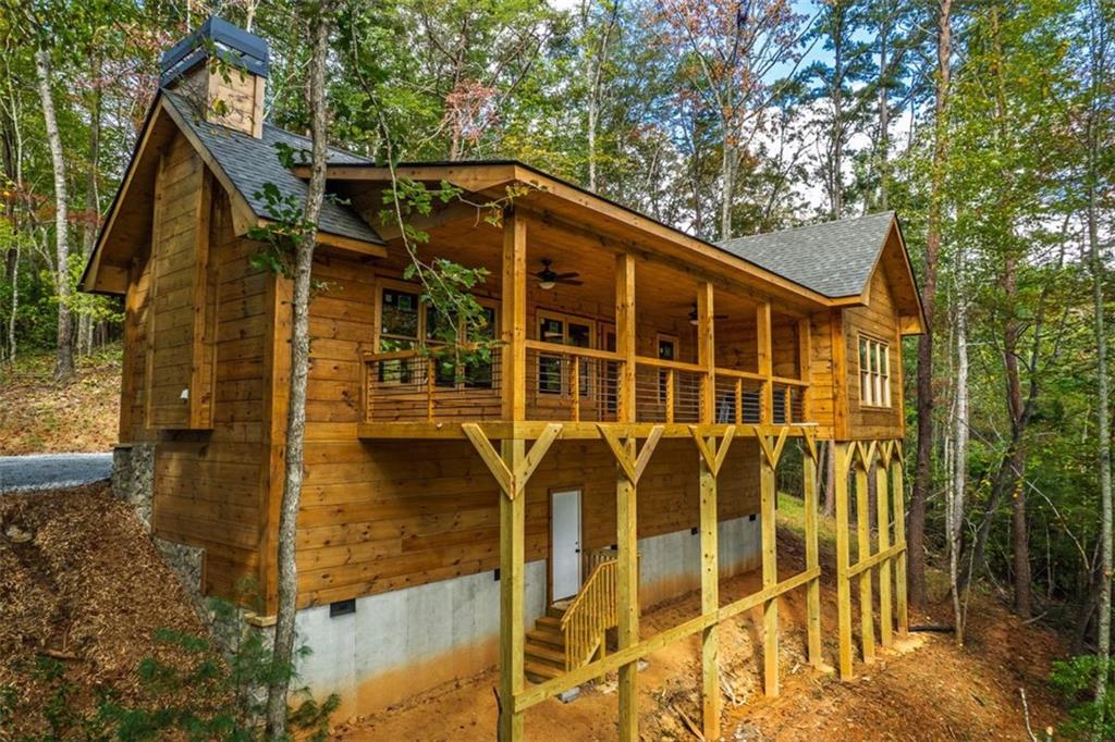 85 Moreland Trail Blue Ridge, GA 30513 - Photo 9 of 37 a front view of a house with a yard