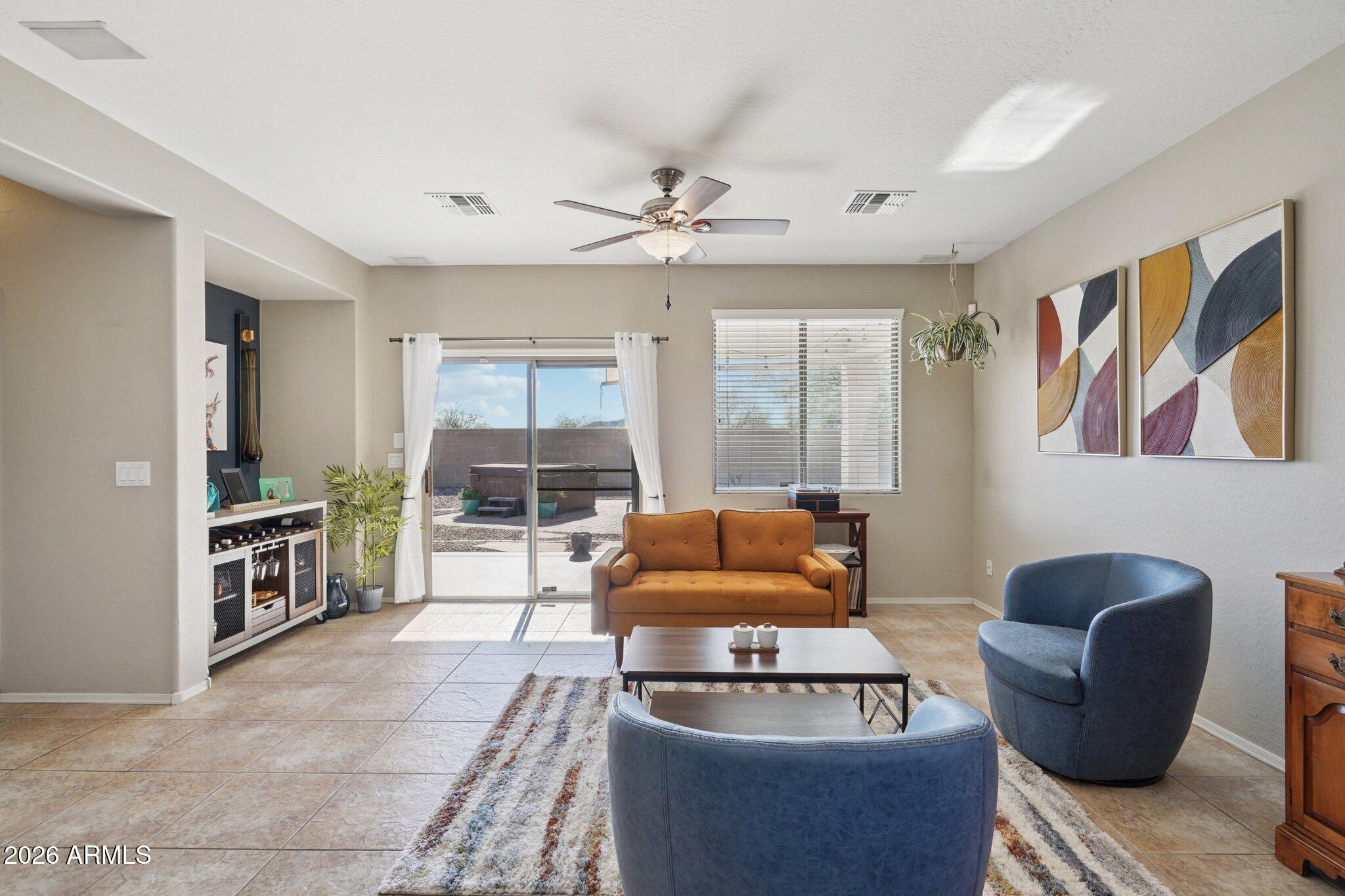 39516 North Noble Hawk Court Phoenix, AZ 85086 - Photo 13 of 62 Living Room off Kitchen