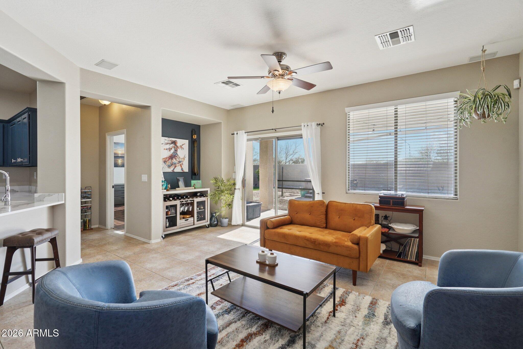 39516 North Noble Hawk Court Phoenix, AZ 85086 - Photo 14 of 62 Living Room off Kitchen