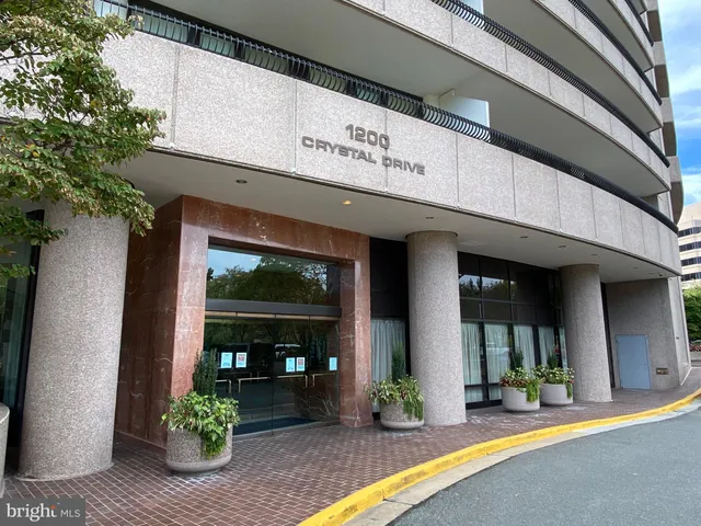 a view of a building with potted plants