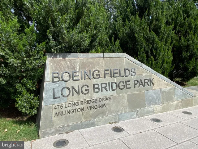 a view of outdoor space with signage and flags