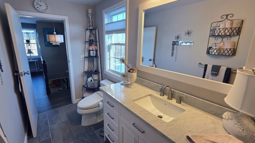 533 Prospect Street West Boylston, MA 01583 - Photo 15 of 40 a bathroom with a granite countertop sink toilet and shower