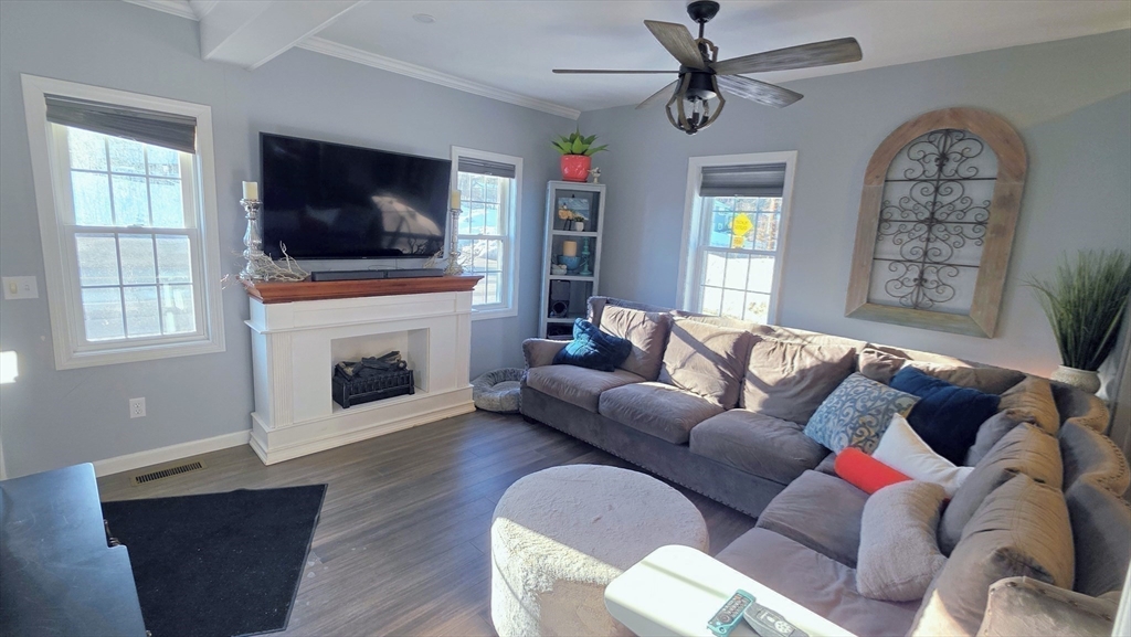 533 Prospect Street West Boylston, MA 01583 - Photo 22 of 40 a living room with furniture a flat screen tv and a fireplace