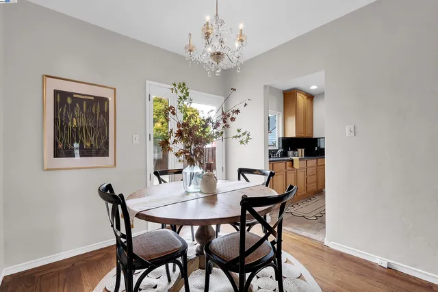 a dining room with furniture and chandelier
