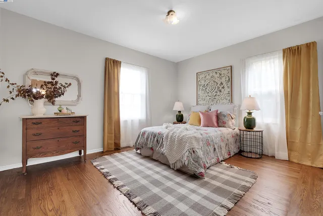 a bedroom with bed and window