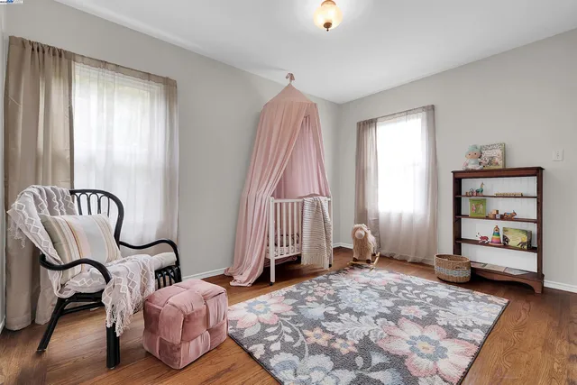 a bedroom with furniture and a window