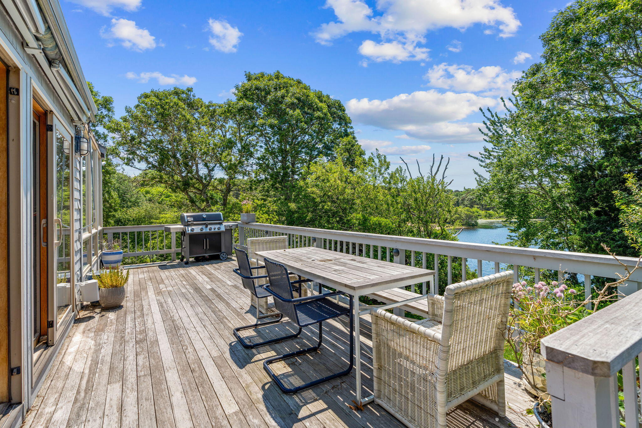 45 Appleseed Road Eastham, MA 02642 - Photo 54 of 57 a balcony with wooden floor and outdoor seating